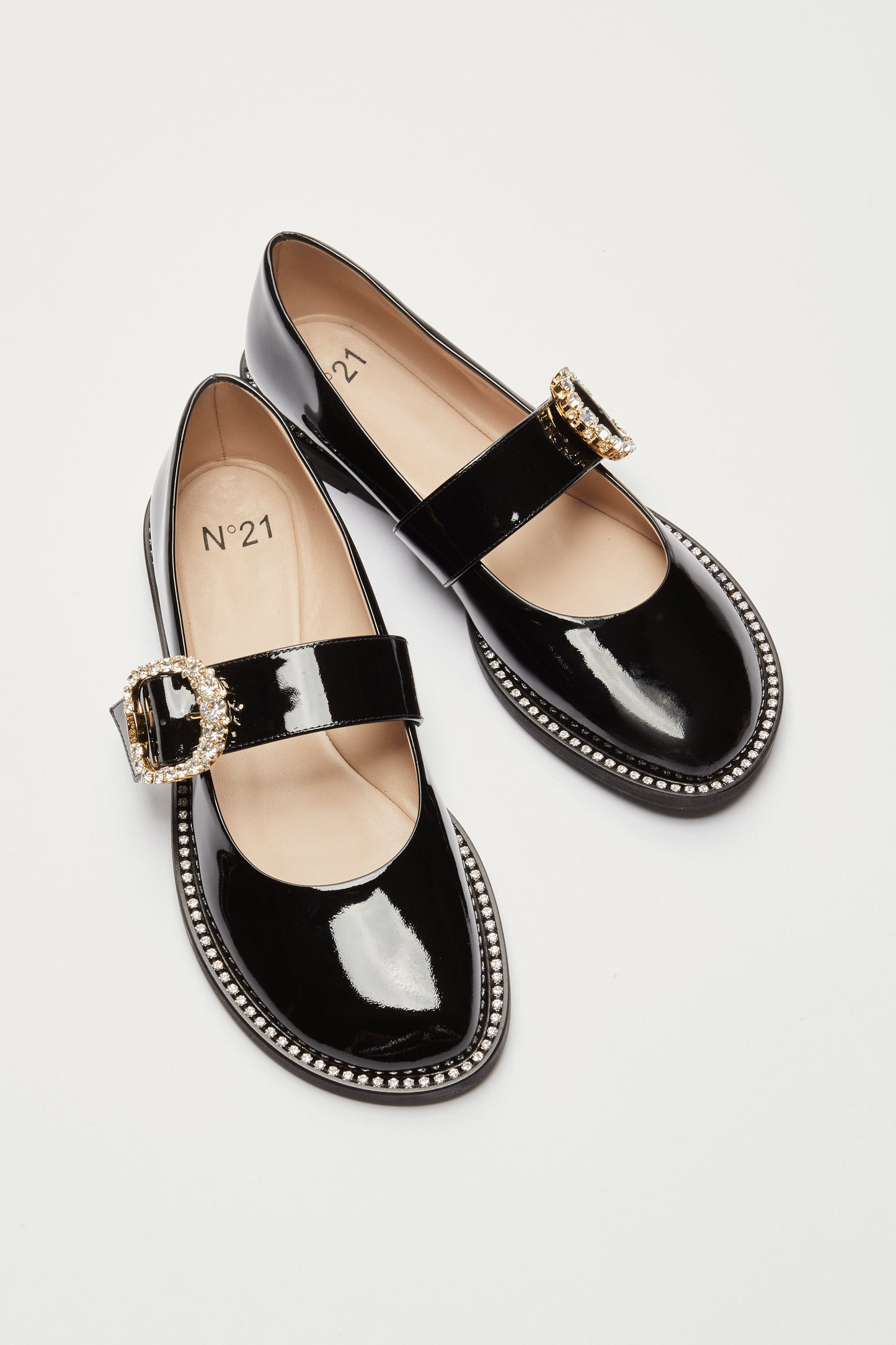 Women's brown leather loafers with gold buckle