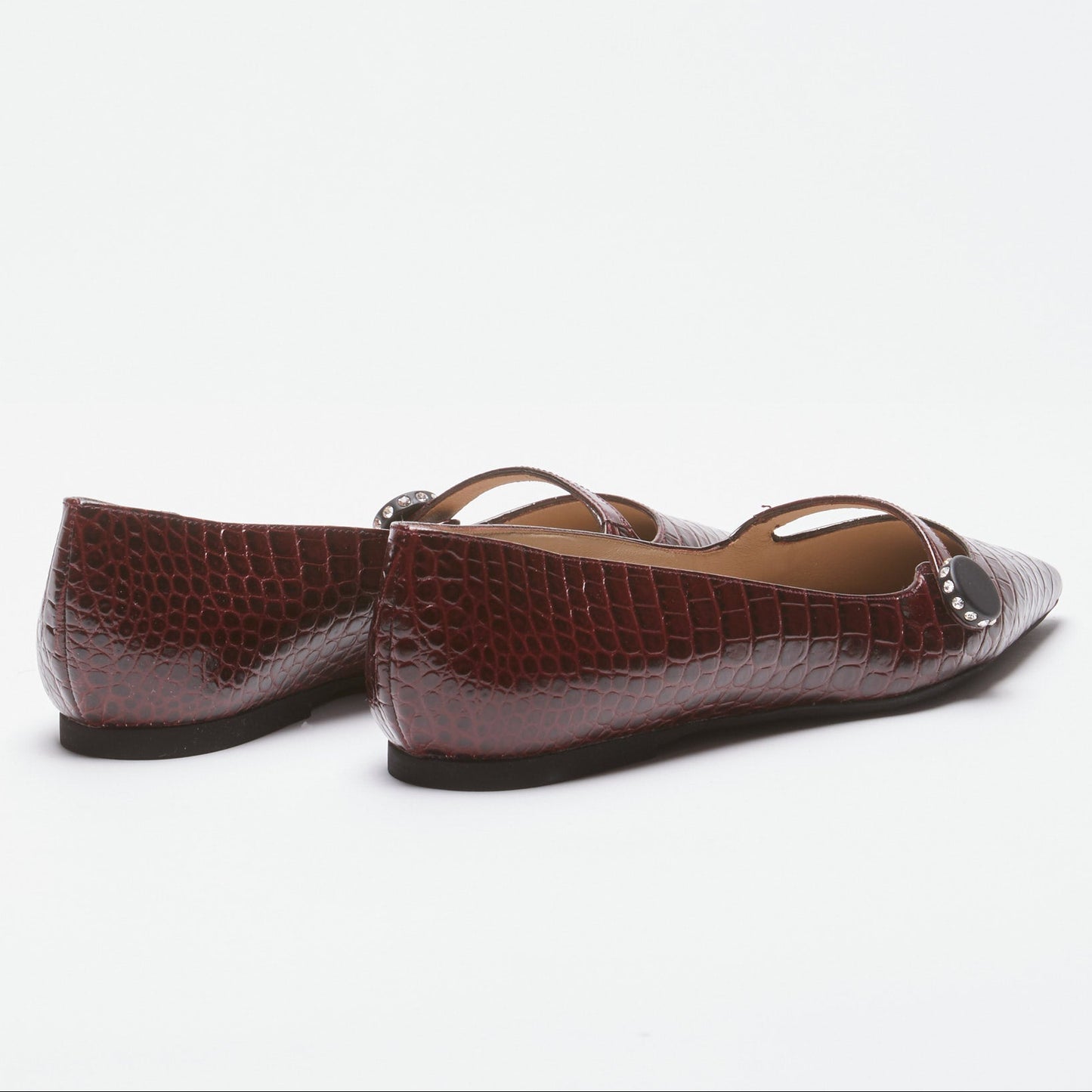 Women's brown pointed-toe flats with bow detail