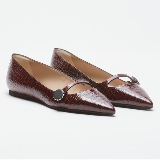 Women's brown pointed-toe flats with bow detail